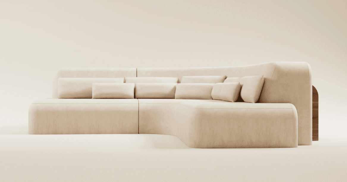 A modular, sectional sofa with rounded edges and plush cushioning. The sofa is upholstered in a light beige fabric and features a series of lumbar pillows. One side of the sofa incorporates a curved wooden accent panel. — 3D model