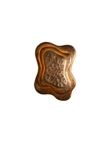 A sculptural wall sconce featuring an organic, multi-layered design in a bronze finish. The light source is positioned behind the contoured metal plates, casting a warm, indirect glow that highlights the irregular shapes and textured surfaces. The outermost layer has a rough, craggy texture, while inner layers are smoother, creating depth and visual interest. — 3D model
