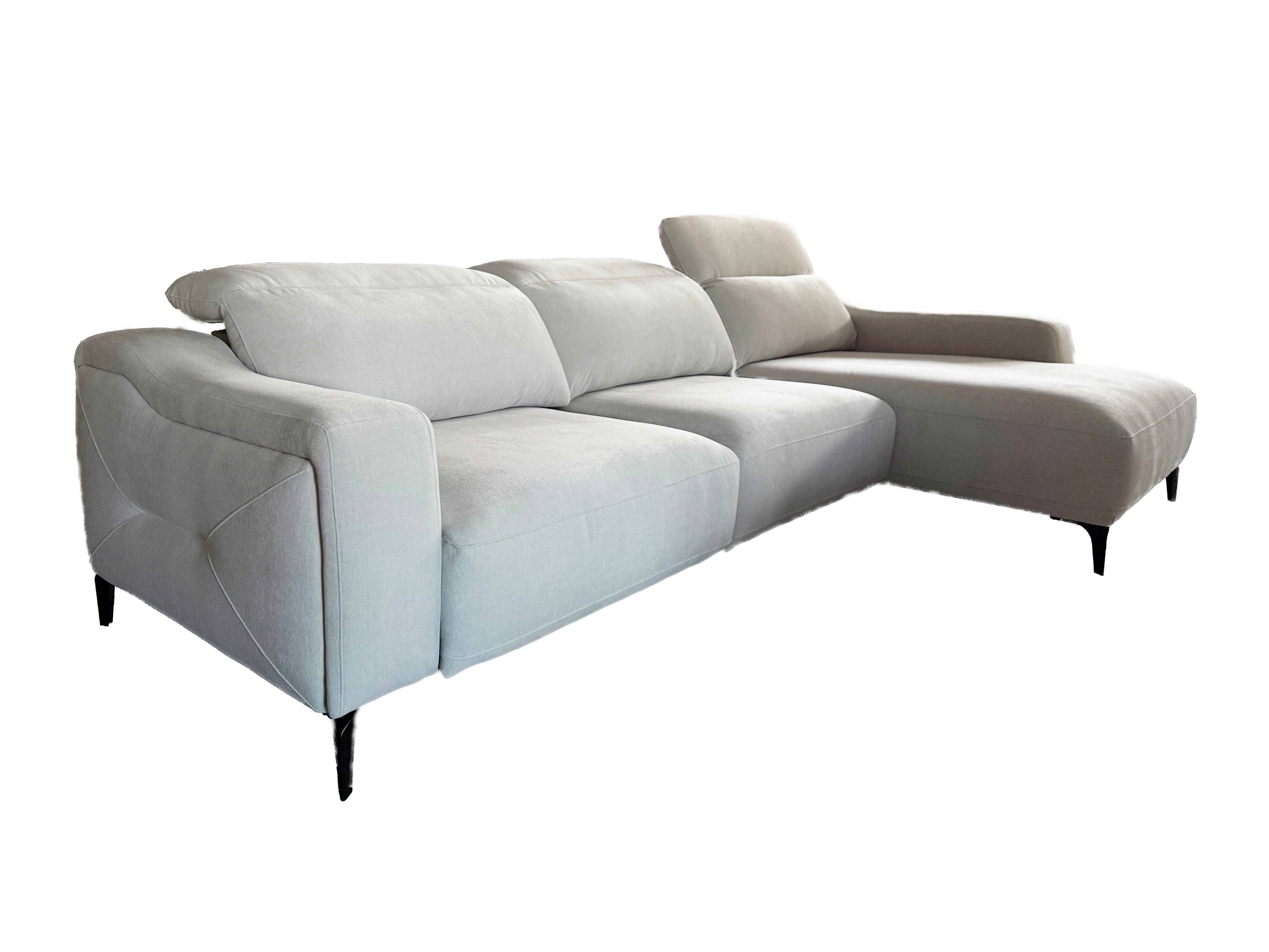 A light gray sectional sofa with a chaise lounge extension. The sofa features plush cushions and a modern design with angular armrests and subtly decorative stitching on the sides. It is supported by slender, dark-colored legs. — 3D model