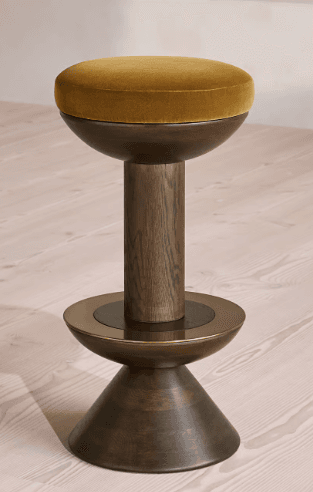 A modern bar stool featuring a round mustard-yellow velvet upholstered seat, supported by a dark-stained cylindrical wood pedestal and a conical wood base, accented with a metallic ring. — 3D model