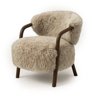 A cozy armchair featuring plush, off-white shearling or faux sheepskin upholstery that covers the seat, back, and inner arms. An exposed dark wood frame forms the outer arms, curving around to become the four tapered legs. The design emphasizes natural materials and soft textures. — 3D model