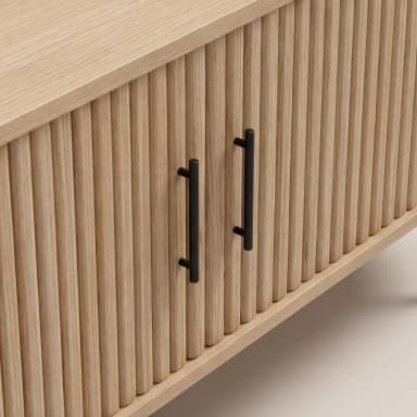 A modern low-profile media console or sideboard cabinet, featuring a natural light wood finish with a distinctive reeded facade, dark metal handles, and slender black metal legs. It has a rounded rectangular form and measures 160cm wide, 55cm high, and 40cm deep. — 3D model