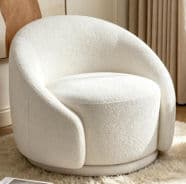 A modern, rounded accent chair featuring a swivel base and upholstered in a cream-colored bouclé fabric. The chair has a compact, circular form with a deep seat and integrated, wide armrests that flow seamlessly into the high backrest, creating a continuous, enveloping silhouette. The textured fabric adds a soft, inviting aesthetic, while the hidden swivel mechanism allows for dynamic positioning. The design emphasizes comfort and contemporary style, suitable for various interior settings. — 3D model