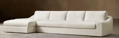 A light-colored contemporary sectional sofa featuring a right-hand chaise lounge component, plush seating, and subtly curved arms. — 3D model
