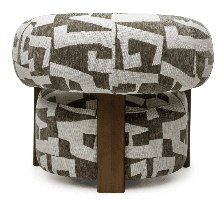 A contemporary barrel-shaped ottoman featuring a distinctive two-tiered upholstered design. The top cushion is a rounded cylinder, and the lower section is a matching upholstered drum, both covered in a durable woven fabric with an abstract geometric pattern in shades of brown and off-white. The two upholstered sections are separated and supported by four sturdy wooden legs with a medium brown finish. This piece functions as both extra seating and a decorative accent. — 3D model