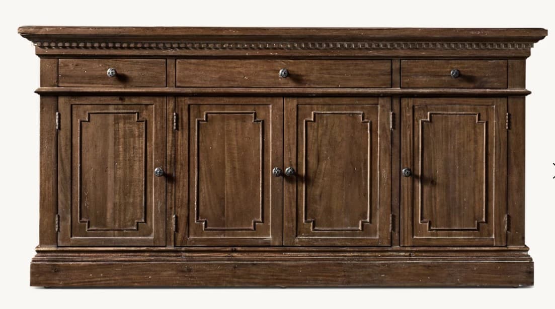 A dark brown wooden credenza with four cabinet doors and three drawers across the top. The doors feature recessed panel detailing with a geometric frame. The drawers have round, metallic knobs. The piece has a decorative molded top edge and a substantial base. — 3D model