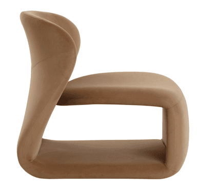 A contemporary, sculptural armless lounge chair, fully upholstered in a camel-colored velvet or velour fabric. The chair features a low-profile, monolithic design with a deeply curved backrest and a continuous, flowing form that integrates the seat and base, creating a distinct, organic silhouette. — 3D model