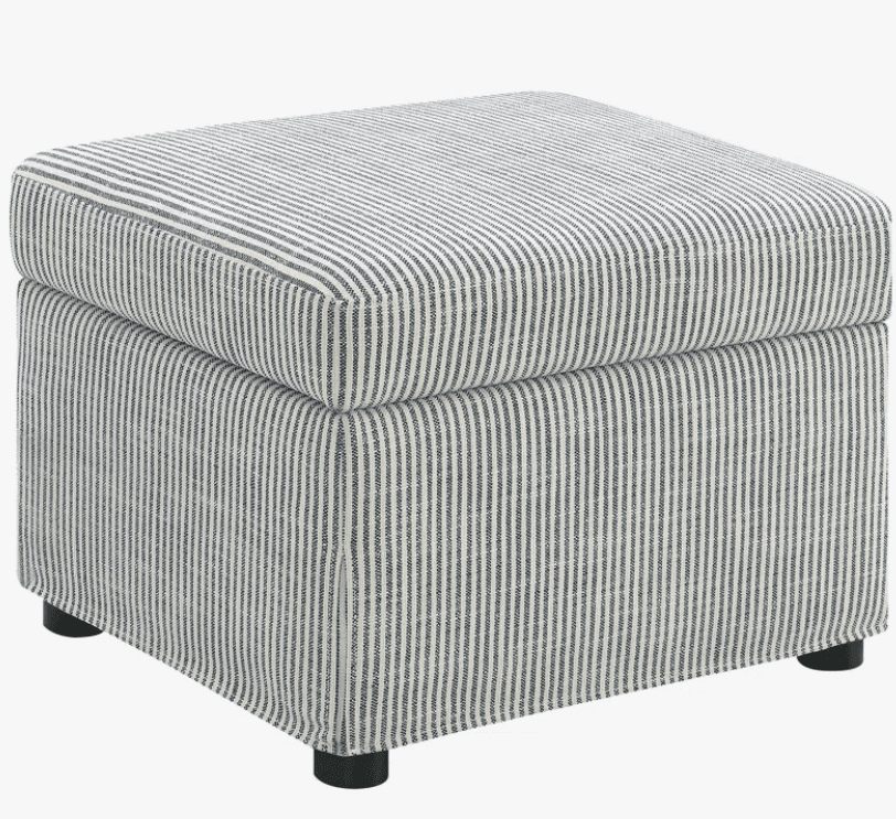 A square upholstered ottoman with a hinged lid, covered in a striped fabric. The ottoman features a skirted base and rests on four small, dark, cylindrical legs. — 3D model
