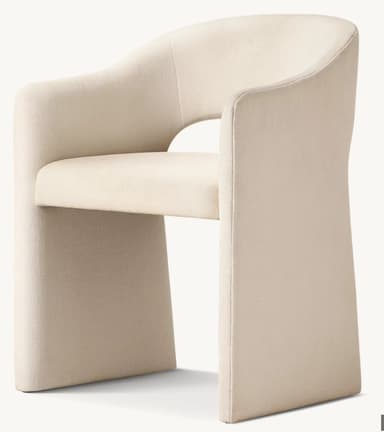 A contemporary upholstered armchair featuring a curved barrel-style back and integrated armrests that flow seamlessly into the fully upholstered base. The chair is covered in a light, textured cream fabric, presenting a monolithic and inviting form. — 3D model