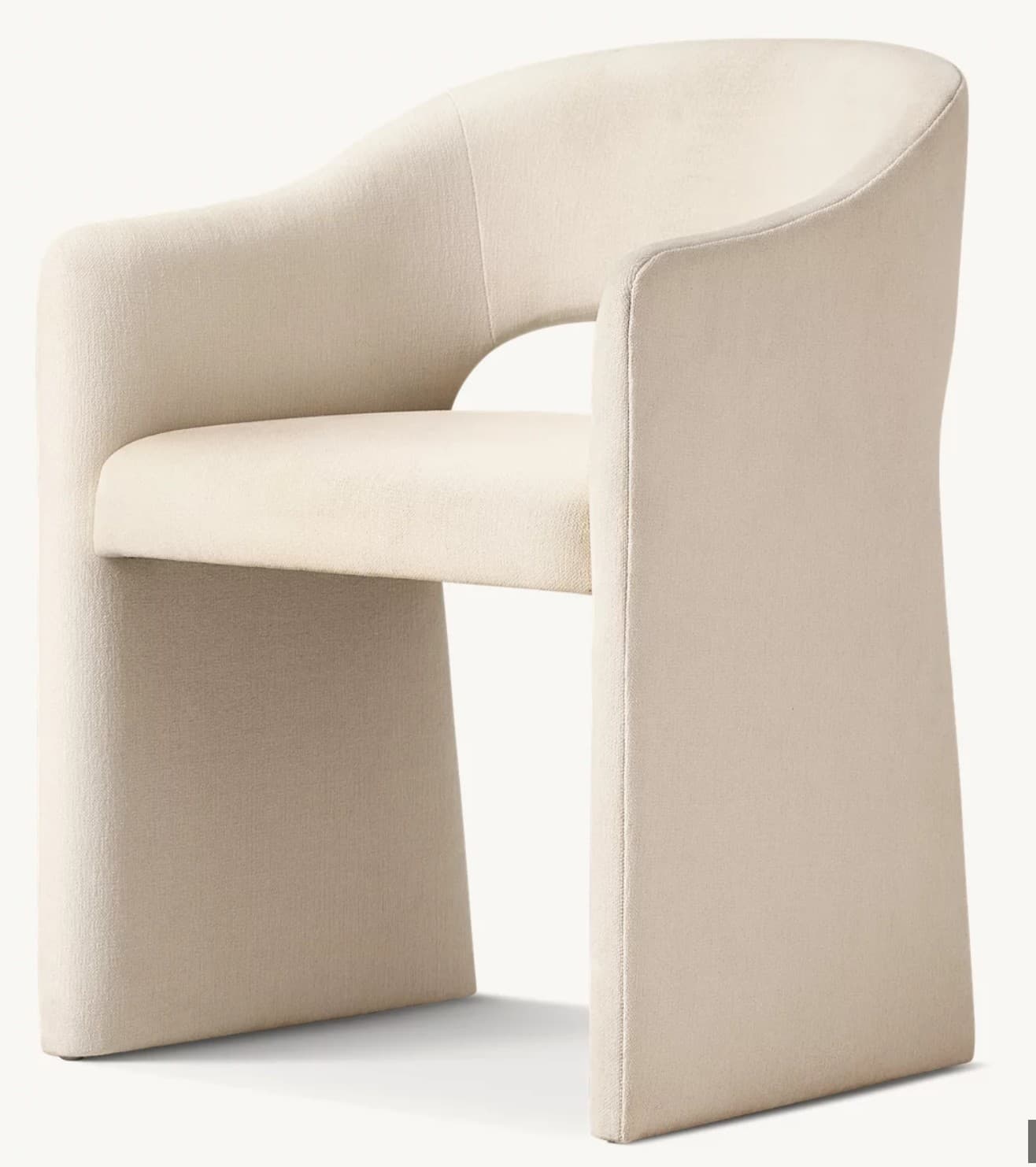 A contemporary upholstered armchair featuring a curved barrel-style back and integrated armrests that flow seamlessly into the fully upholstered base. The chair is covered in a light, textured cream fabric, presenting a monolithic and inviting form. — 3D model