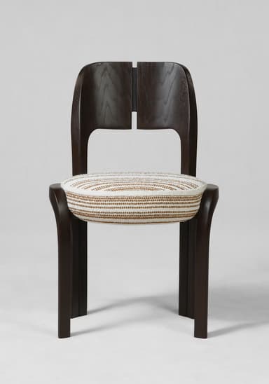 A dark wood dining chair with a rounded, split backrest and a woven seat cushion. The chair has a modern aesthetic with curved legs and a streamlined frame. The seat cushion is upholstered in a textured fabric with a striped pattern in white and brown tones. — 3D model