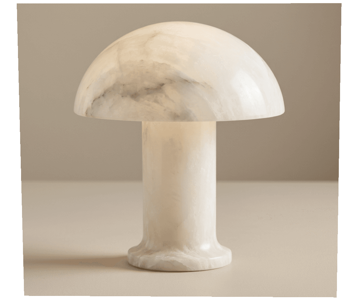 A distinctive table lamp featuring a design inspired by a mushroom. The lamp's shade is a smooth, rounded dome, and its base is a cylindrical stem that flares out slightly at the bottom. The entire lamp is crafted from alabaster, a translucent stone that allows light to diffuse gently, creating a warm and ambient glow when illuminated. The natural veining within the alabaster adds subtle, organic patterns to the lamp's surface, making each piece unique. This lamp serves as both a functional light source and a sculptural decorative object. — 3D model