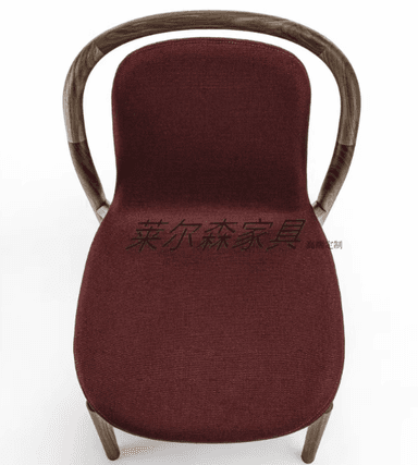A modern dining chair with a curved wooden frame and a upholstered seat and backrest. The chair features slender, bentwood legs and armrests that merge into the back support. The upholstery is a textured, dark red fabric. — 3D model