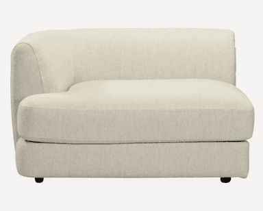 A cream-colored, modular armchair with a curved backrest and armrest. It features a textured upholstery and a low profile base with small black feet. — 3D model