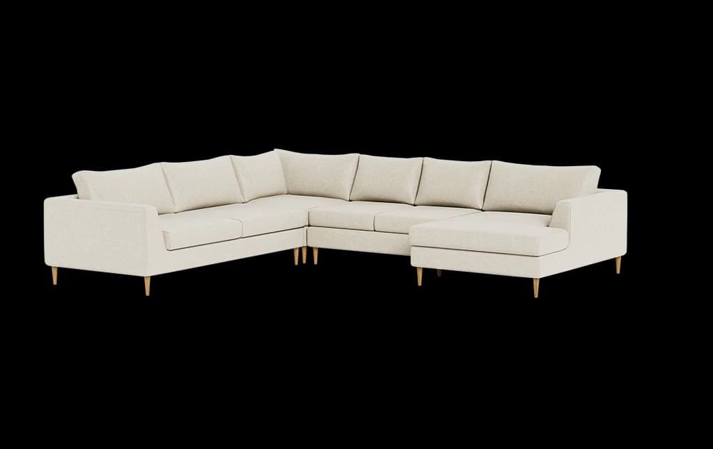 A modern U-shaped sectional sofa upholstered in a light beige fabric. The sofa features a low-profile design with wide, flat armrests and loose back cushions. It comprises multiple modular sections, including a central three-seater, a corner piece, and an extended chaise lounge on the right side. The sofa is supported by short, tapered wooden legs, lending it a minimalist and contemporary aesthetic. The fabric has a subtle woven texture. — 3D model