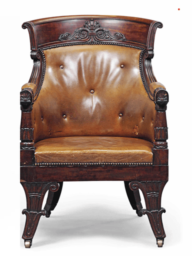 A classical armchair with a curved, tufted leather seat and back, upholstered with brass tack detailing. The wooden frame is dark stained and features carved decorative elements on the crest rail, armrests, and legs. The chair is supported by four carved legs, two of which have brass casters. — 3D model