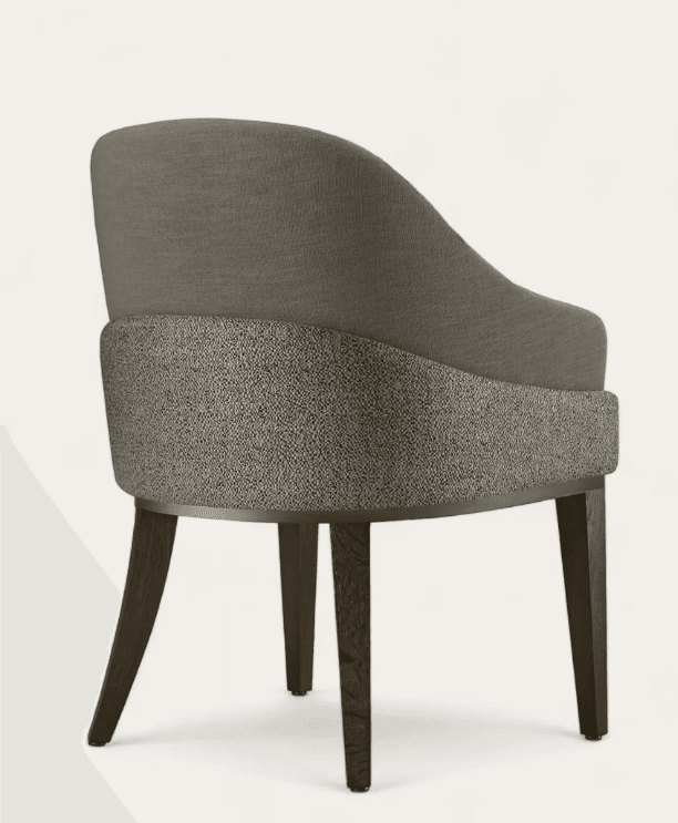 A contemporary dining armchair featuring a curved backrest and integrated armrests, upholstered in two contrasting textile fabrics. The upper part of the chair is a smooth, solid grey fabric, while the lower exterior showcases a textured, mottled grey fabric. A bronze or brass-toned metal trim separates the two upholstery sections. The chair is supported by four dark, tapered wooden legs. — 3D model