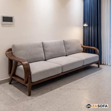 A three-seater sofa featuring a distinctive exposed wooden frame with gracefully curved armrests and tapered legs. The upholstery consists of three light grey fabric seat cushions and three matching back cushions, providing a clean and inviting appearance. The rich, dark wood grain of the frame contrasts elegantly with the light fabric. — 3D model