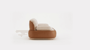 A contemporary two-seater loveseat featuring a dual-material design. The upper seating area, including the back cushions, seat cushions, and armrests, is upholstered in a light cream-colored, textured bouclé fabric, offering a soft and inviting appearance. The back and seat cushions are distinct, plump, and rounded. The lower perimeter of the sofa is encased in a smooth, curved tan-brown leather or faux leather panel, which provides a contrasting texture and color. This leather section is subtly elevated by a thin, light-toned wooden plinth base that forms the lowest part of the furniture piece, completing its minimalist and elegant aesthetic. — 3D model