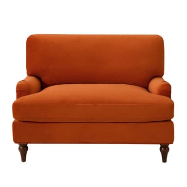 A plush, deep-seated armchair upholstered in a vibrant rust orange velvet fabric. It features rolled arms, a T-cushion backrest, and a single seat cushion. The chair is supported by four dark, turned wooden legs. — 3D model