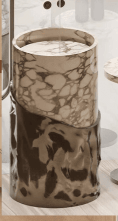 A contemporary cylindrical accent table featuring a white marble top section with grey veining, contrasting with a dark, textured metallic base that has a molten or organic finish. The two sections are seamlessly joined, creating a visually distinct two-tone design. — 3D model