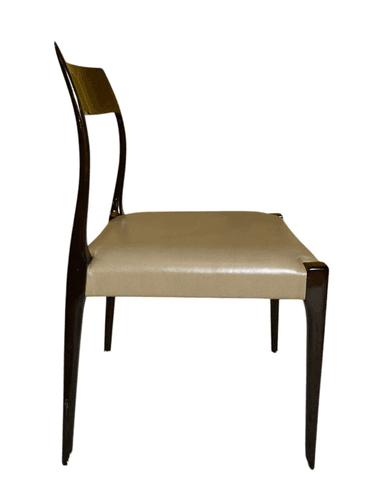 A minimalist chair featuring a dark, possibly rosewood or mahogany, curved frame and slender, tapered legs. The seat and a small upper backrest pad are upholstered in a light, cream-colored material, likely leather or faux leather. The chair has an elegant, streamlined profile, characteristic of mid-century design, designed for dining or as an accent piece. — 3D model