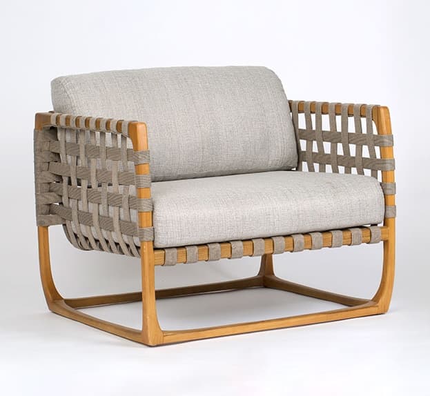A modern lounge chair featuring a natural wood frame, woven strap detailing on the arms and back, and thick, light grey upholstered cushions. — 3D model