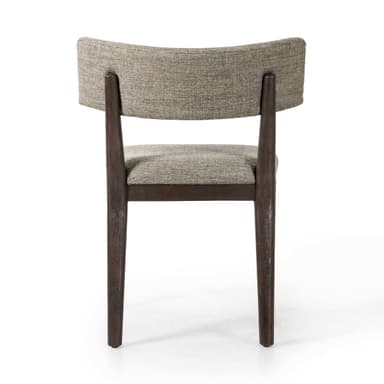 A side chair with a wooden frame and upholstered seat and backrest. The frame has a dark finish and appears to be constructed from solid wood. The seat is rectangular and the backrest is composed of two curved upholstered panels attached to a wooden support. The legs are straight and slightly tapered. — 3D model