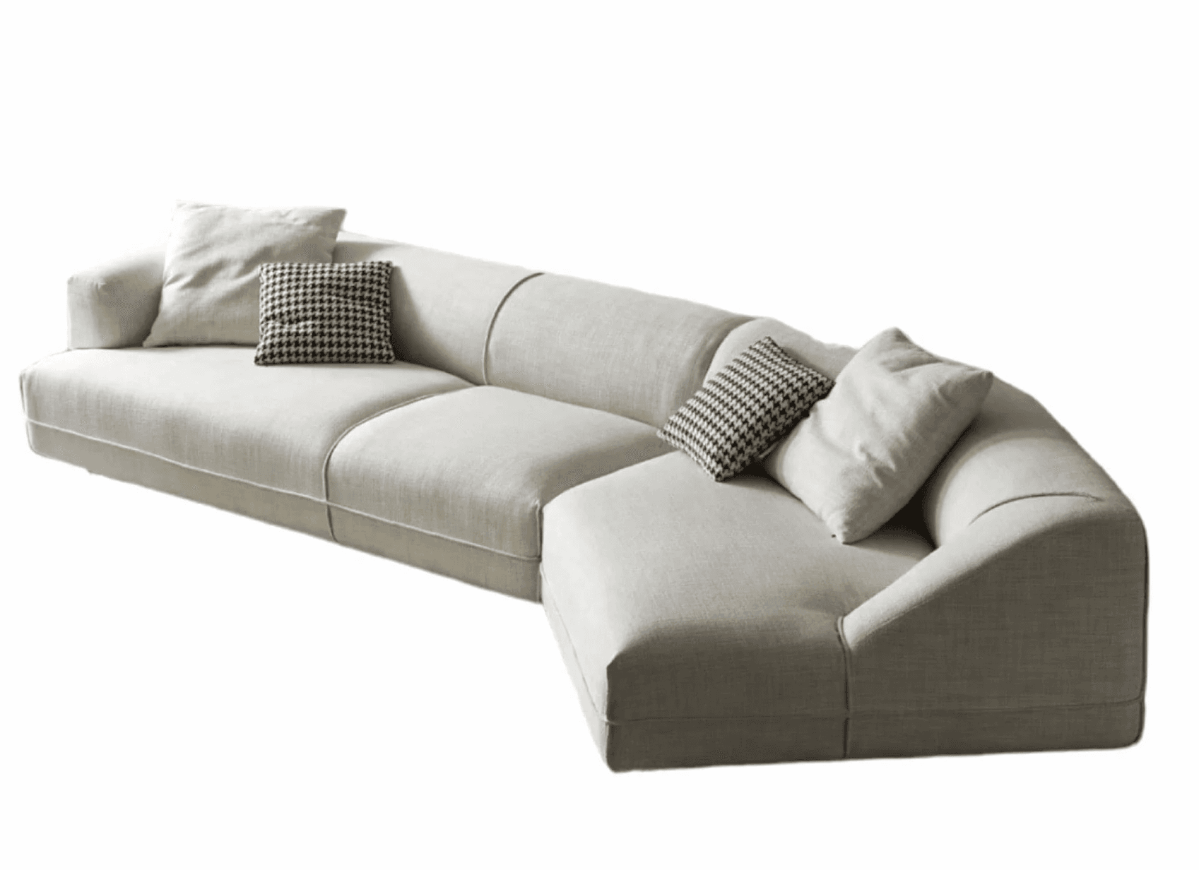A sectional sofa with a chaise lounge extension. The sofa features a low profile with clean lines and plush cushions. It is upholstered in a textured, off-white fabric and includes decorative throw pillows, some with a black and white houndstooth pattern. The corner section has a curved backrest. — 3D model