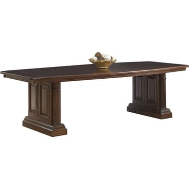 A long, rectangular dining table constructed from dark wood, supported by two substantial pedestal bases. The table features a smooth, flat top with a slightly rounded edge. Each pedestal base is composed of a central column with recessed paneling, fluted details, and rests on a wide, tiered rectangular plinth, imparting a classic and sturdy aesthetic. — 3D model