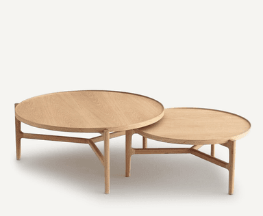 A set of two round coffee tables designed to nest, featuring light oak wood construction and a minimalist, Scandinavian-inspired design. — 3D model