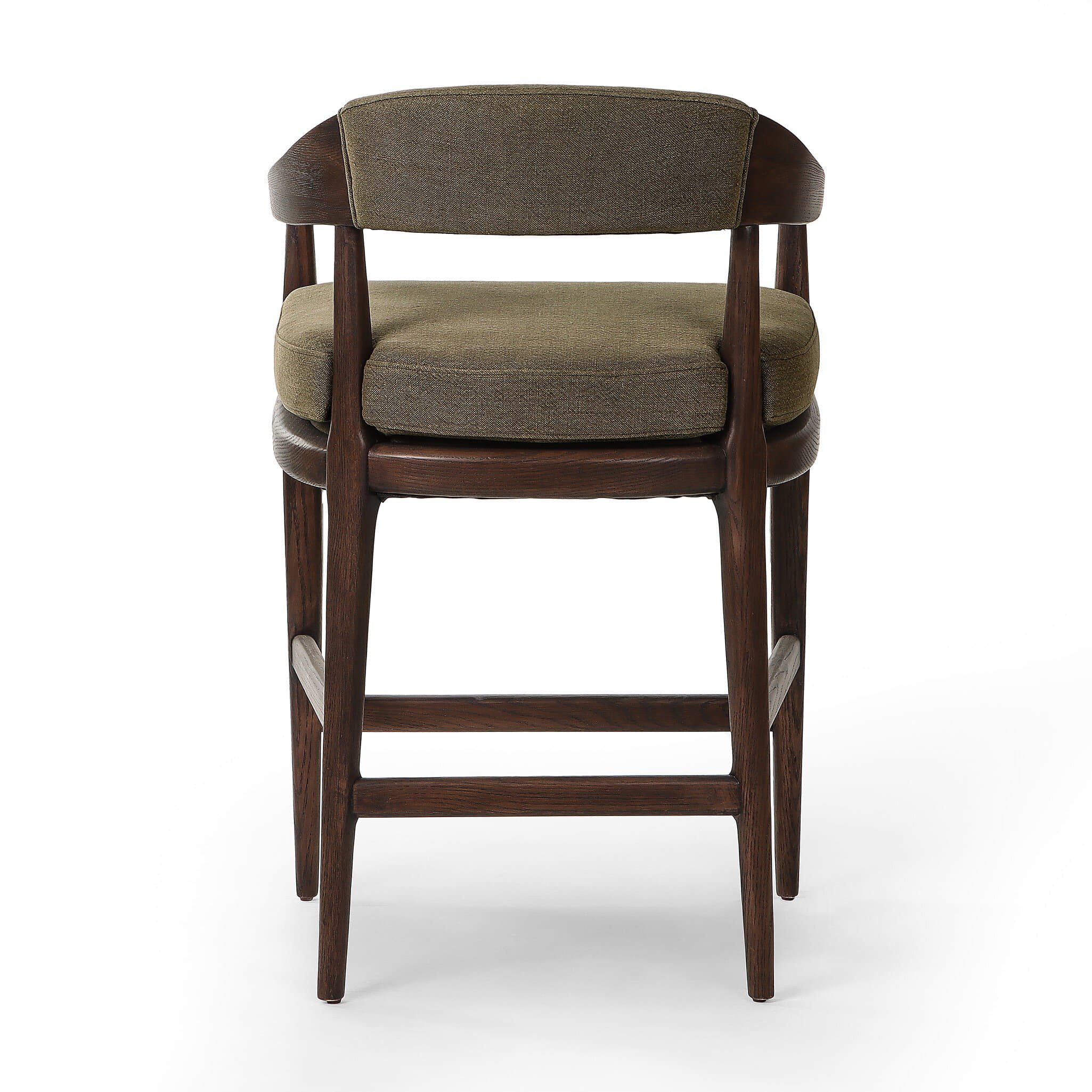 A bar stool with a wooden frame and upholstered seat and backrest. The frame is constructed from dark wood with visible grain. The seat and backrest are upholstered in a textured, olive-green fabric. The stool has a curved backrest that extends to armrests, and its legs are supported by crossbars. — 3D model