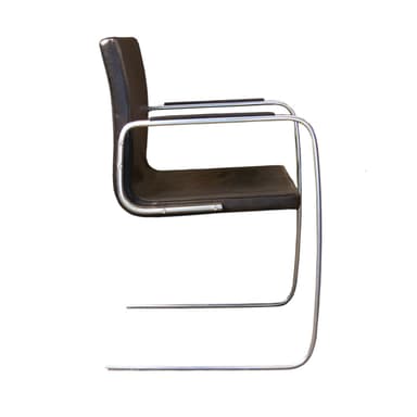A cantilever armchair with a dark brown leather seat and backrest, supported by a tubular chrome-plated steel frame. The frame features a continuous curve for the legs and arms, creating a minimalist and modern aesthetic. — 3D model