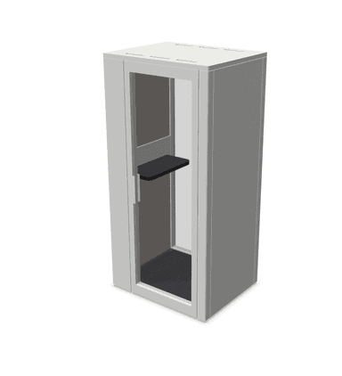 A compact, freestanding booth with a modern, minimalist design. It features a glazed front panel for entry, allowing natural light and visibility. Internally, it is equipped with a dark-colored floor mat and a cantilevered shelf, suggesting a functional space for temporary use like phone calls or focused work. The exterior is finished in a neutral gray tone, and the construction appears to be panel-based. — 3D model
