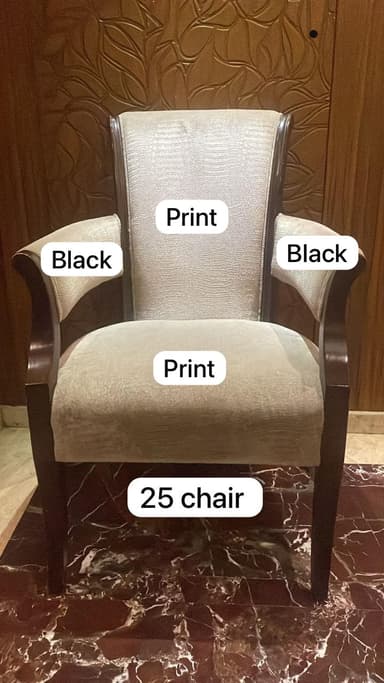 An upholstered armchair featuring a dark stained wooden frame, a light beige patterned fabric on the seat and back, and contrasting black removable arm covers. The chair has a curved backrest and elegantly curved wooden armrests, supported by four tapered legs. — 3D model