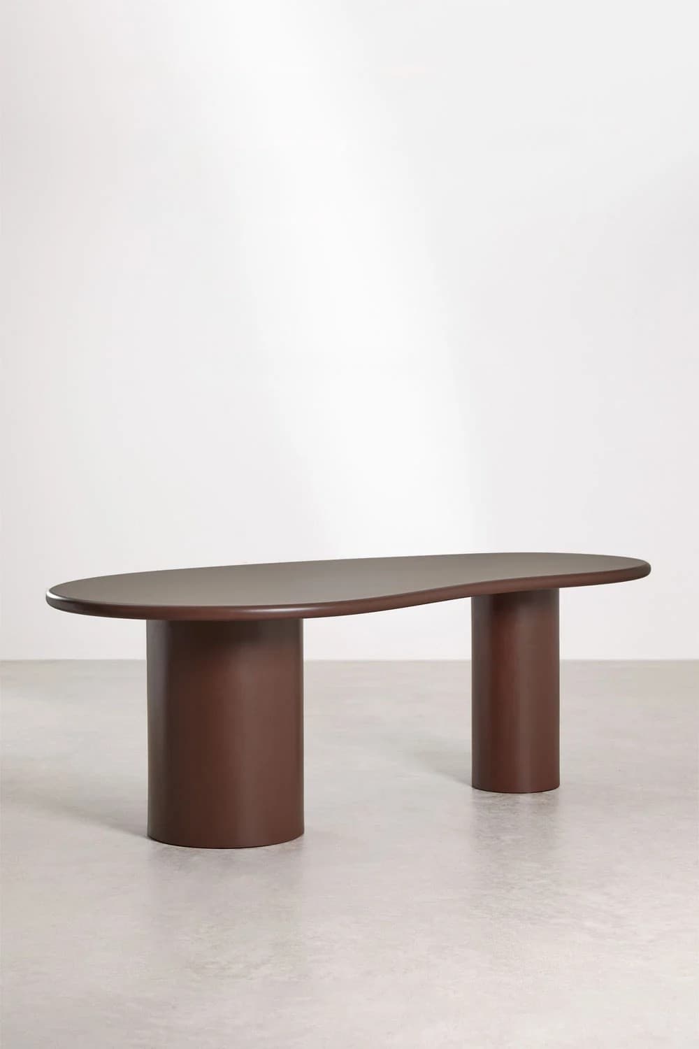 An irregularly shaped coffee table with a unique, organic form. It features a flat, wide tabletop with rounded edges and two cylindrical legs of varying heights supporting it. The legs are positioned asymmetrically, contributing to the piece's distinctive silhouette. The overall design suggests a modern or contemporary aesthetic. — 3D model