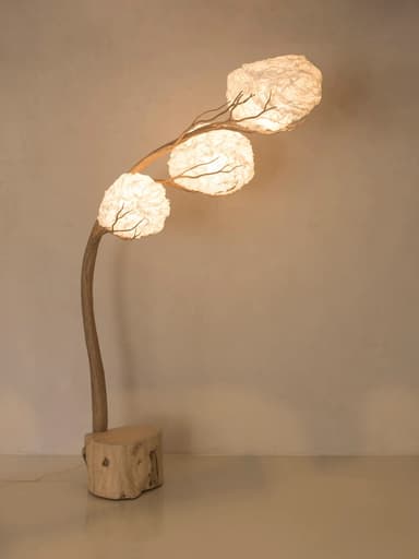 An artistic floor lamp featuring a natural wood block base, a gracefully curving branch-like stem, and three spherical, crinkled white paper or fabric shades designed to resemble blossoms or clouds. — 3D model