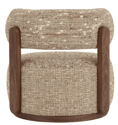 A modern accent chair featuring a distinctive design with a rounded, cylindrical upholstered backrest and a circular upholstered seat. The chair is covered in a textured, boucle-style fabric with a mixed weave of light and dark threads, creating a speckled appearance. The backrest is supported by dark wooden posts that connect to the wooden base beneath the seat. The base itself is a dark, circular wooden platform, providing stability and a contrasting element to the upholstery. The overall form is compact and inviting. — 3D model