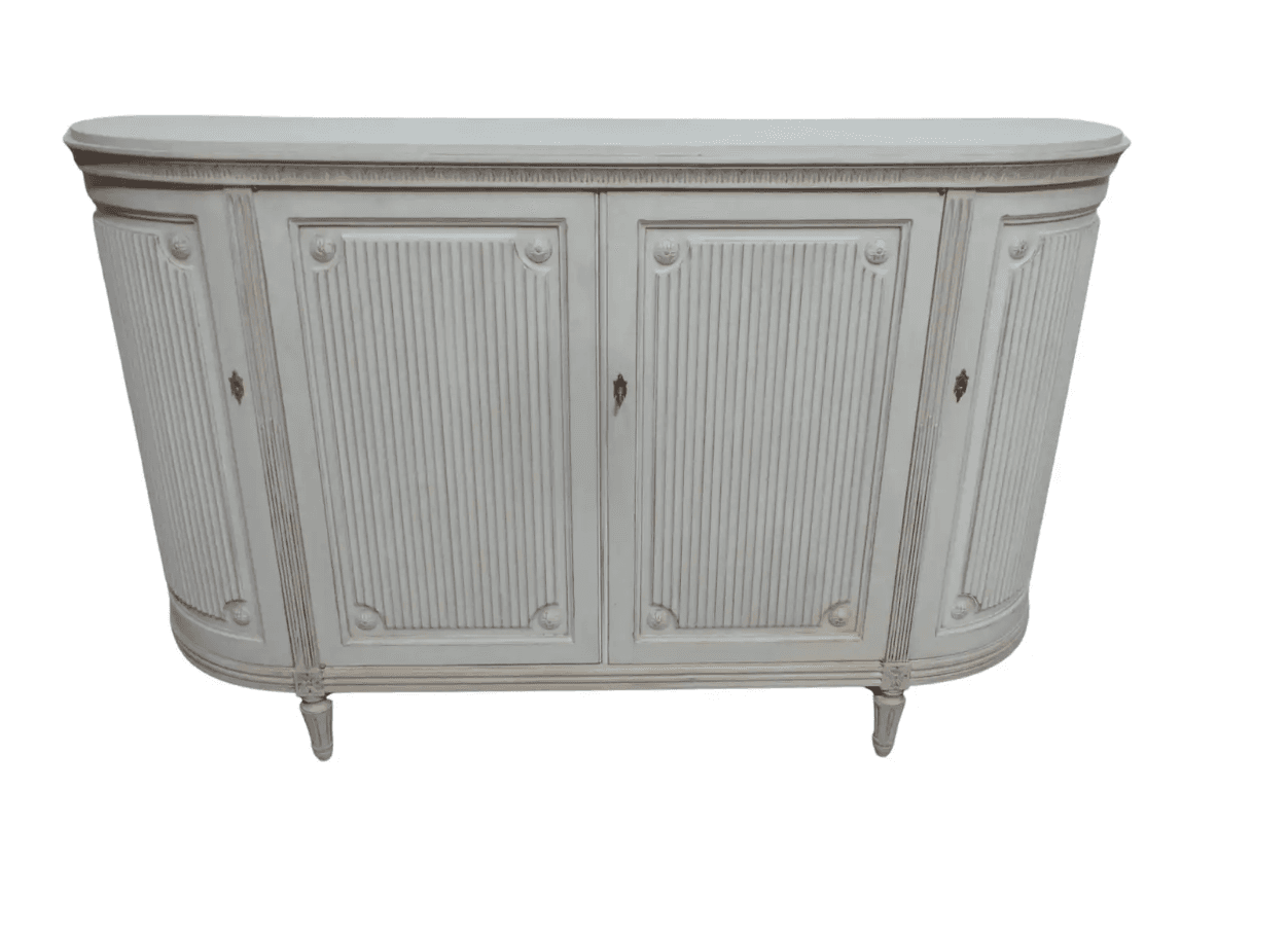 A distressed light grey or off-white demilune cabinet featuring Neoclassical design elements such as fluted panels and carved rosettes, supported by tapered legs. It has multiple doors for storage. — 3D model