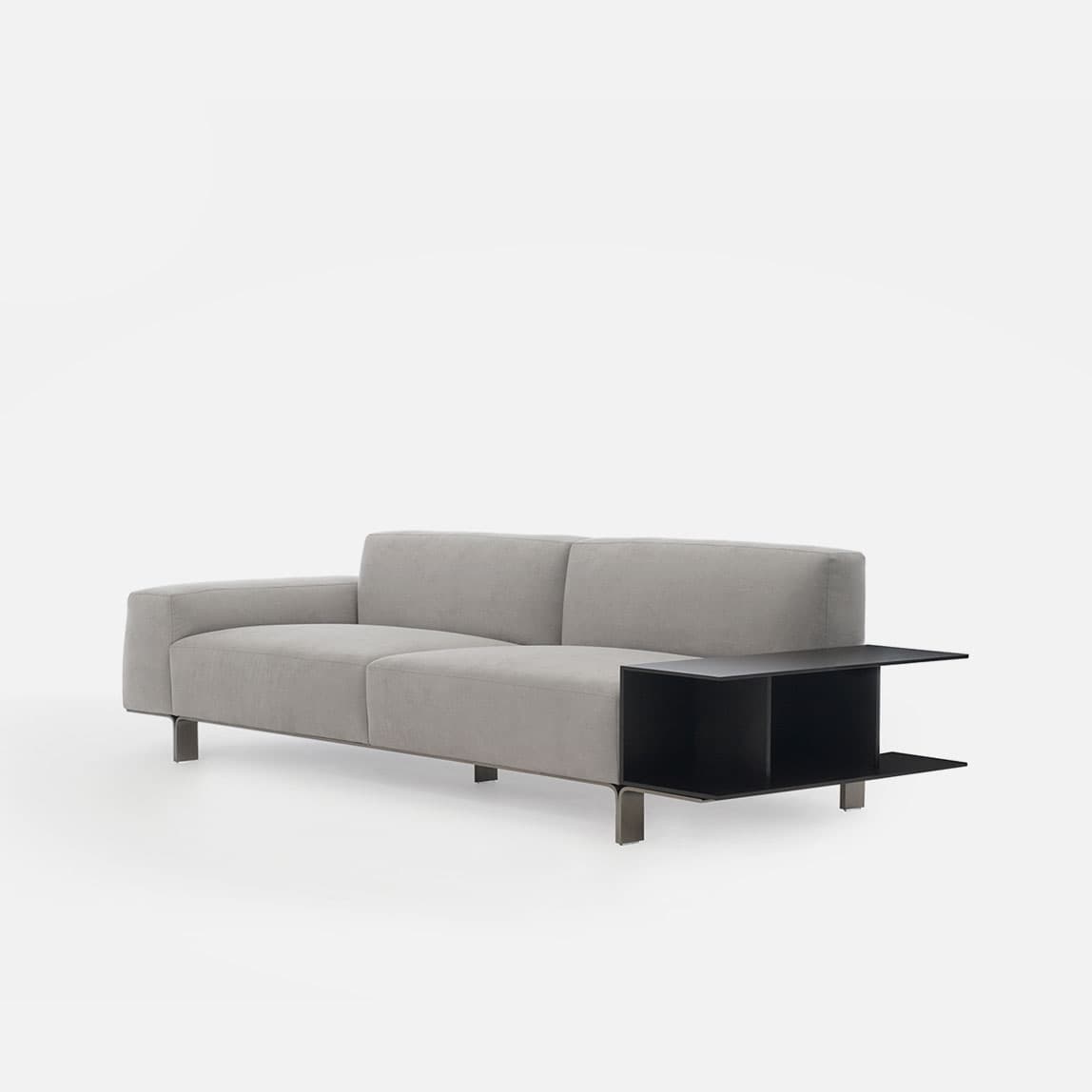 A modern two-seater sofa upholstered in light grey fabric, featuring a minimalist design with slim metal legs and an integrated black rectangular side table with open shelving on one end. — 3D model
