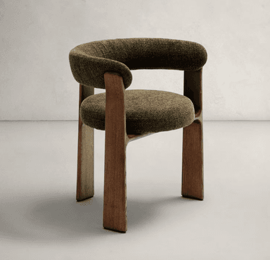 An armchair with a rounded, upholstered backrest and seat, supported by a solid wooden frame. The wooden elements have a visible grain and a matte finish, forming the legs and connecting the seat to the backrest. The upholstery is a textured fabric in a deep olive green color. — 3D model