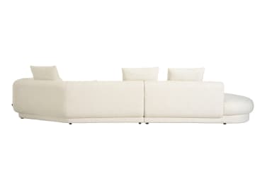 A large, curved sectional sofa upholstered in a light, textured boucle fabric, featuring a left-hand chaise extension and a unique right-hand armrest with a recessed wooden panel. The sofa includes several matching decorative pillows, both square and round. — 3D model