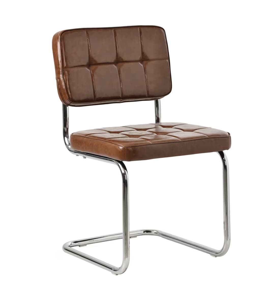 An armless dining chair featuring a cantilever chrome-plated metal frame and brown square-tufted faux leather upholstery on both the seat and backrest. — 3D model
