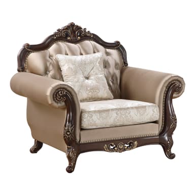 An ornate single-seater armchair featuring a dark, richly carved wooden frame with gilded accents, and plush, light beige upholstered seating. The chair's design includes a prominent crest rail with intricate rococo-style carvings, scrolled armrests, and cabriole-style legs, all detailed with gold. The upholstery is secured by continuous brass nailhead trim along the edges. — 3D model