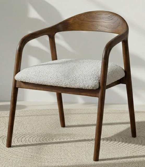 A modern armchair with a curved wooden frame and a cushioned seat. The frame features a rounded backrest that seamlessly integrates into the armrests, supported by four tapered legs. The seat is upholstered in a textured, light-colored fabric. — 3D model