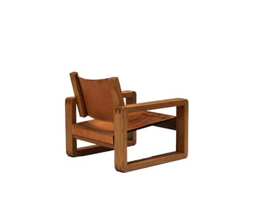 A sturdy lounge chair featuring a prominent wooden frame and distressed leather sling seat and backrest. The design emphasizes a rectilinear, architectural form with visible joinery. — 3D model
