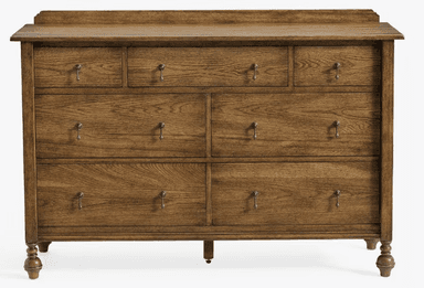 A wooden dresser with multiple drawers. It features a top surface with a raised edge, and a series of drawers of varying sizes arranged in a grid. The drawers are equipped with simple, metallic pull handles. The dresser stands on four turned legs, with the front legs having a more decorative, bulbous shape. — 3D model