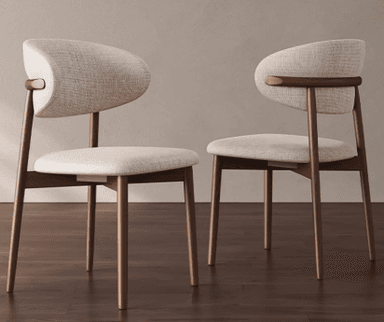 A modern dining chair featuring a dark wood frame and light-colored fabric upholstery. The chair has a distinctive curved backrest that appears to wrap around slightly, offering ergonomic support. The seat is a rectangular cushion, also upholstered in the same light fabric. The four legs are tapered and constructed from wood, providing a minimalist and stable base. The overall design suggests a contemporary aesthetic, prioritizing comfort and sleek lines. — 3D model