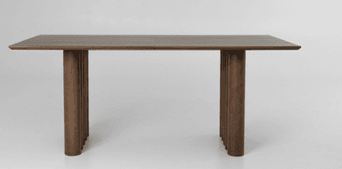 A contemporary rectangular dining table featuring a dark wood finish and distinctive fluted pedestal bases. The tabletop appears to be constructed from two panels, joined at the center, resting atop two substantial cylindrical bases composed of vertical fluted elements. The overall aesthetic is minimalist yet refined. — 3D model
