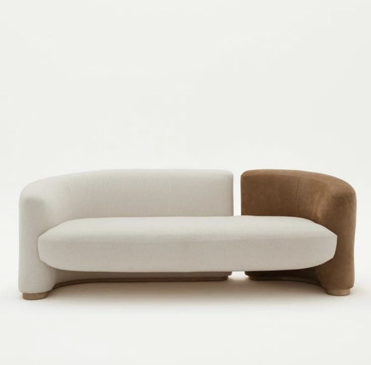 An asymmetrical two-seater upholstered loveseat featuring a dual-material and dual-color design. One side, including the main seating area, is in a cream textured fabric, while the opposing arm is in a contrasting brown nubuck leather. — 3D model